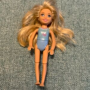 Vintage Blonde Doll with Blue Outfit at Chelsea beach club